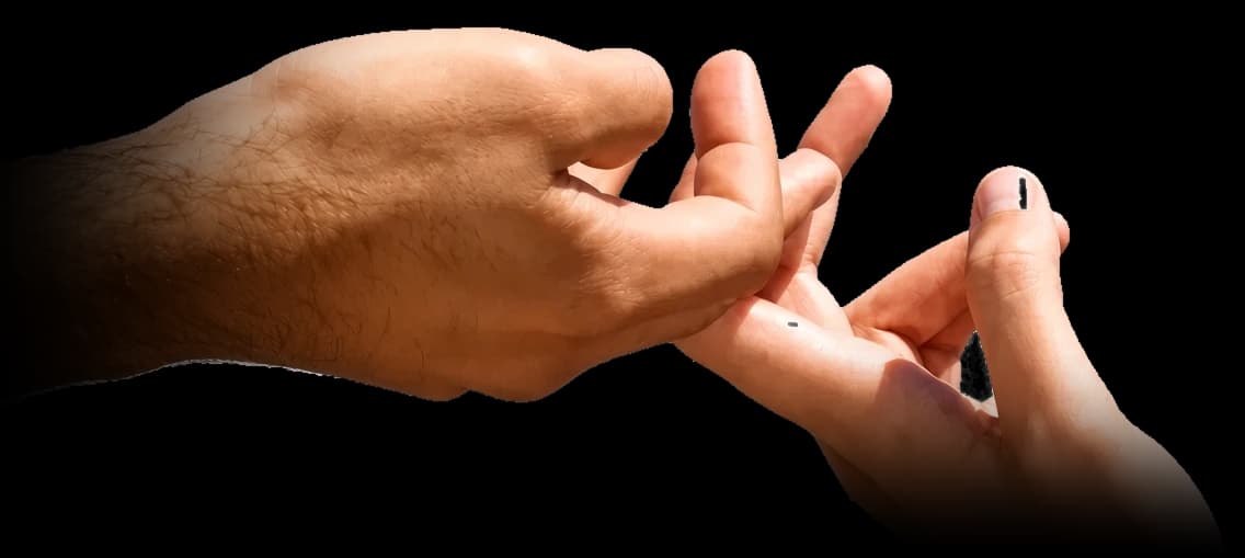 Two hands reaching toward each other